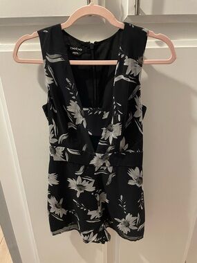 Bebe Black Floral Sleeveless Romper, size 0